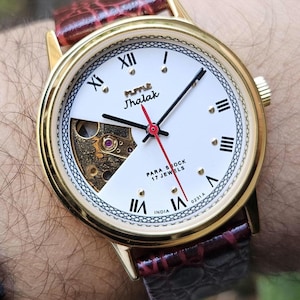 HMT Jhalak Skeleton Watch: White Dial, Roman Numerals, 17 Jewels