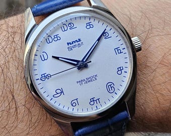 Reloj de pulsera vintage HMT Janata Tamil con números azules, 17 joyas y cuerda manual.