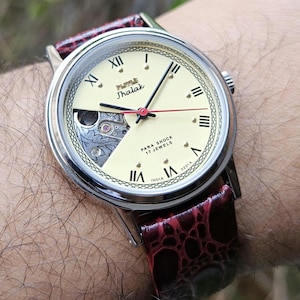 HMT Jhalak Skeleton Watch: Yellow Dial Roman Numerals, 17 Jewels