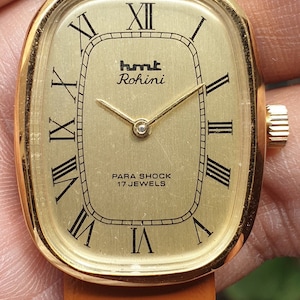 HMT Rohini Oval Golden Dial Roman Numerals Hand Winding 17 Jewels Women&#39;s Wrist Watch