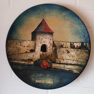 A set of hand made vintage enameled decorative souvenir wall art/saucers every piece is unique