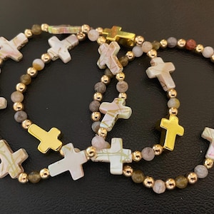 Shell cross bracelet with gold accents