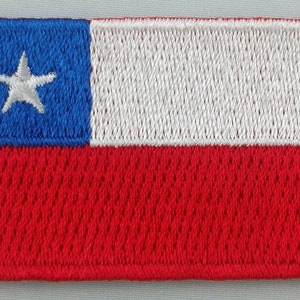 May include: Embroidered patch of the Chilean flag. The flag features a blue rectangle with a white star in the upper left corner, a white rectangle in the middle, and a red rectangle at the bottom.