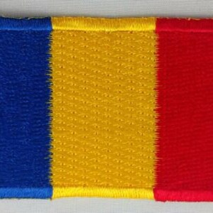 May include: Embroidered patch featuring a vertical tricolor design. The patch is divided into three equal sections: blue on the left, yellow in the center, and red on the right. The edges are neatly stitched, and the colors are vibrant.