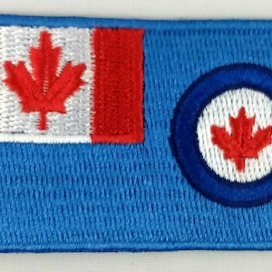 May include: Embroidered patch featuring the Canadian flag with a red maple leaf on a white background and a blue circle with a red maple leaf on a white background on a blue background.