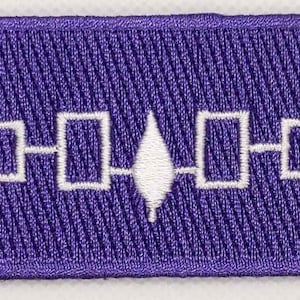 May include: Purple embroidered patch with a white design of a diamond shape with four squares connected to it by lines.