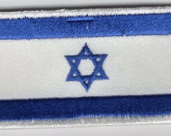 May include: Rectangular patch featuring the flag of Israel. The design includes a white field with a blue Star of David in the center, and blue horizontal stripes at the top and bottom. The patch is bordered with white stitching.