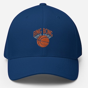 May include: A blue baseball cap with an embroidered basketball and the text "Bing Bong" above it.