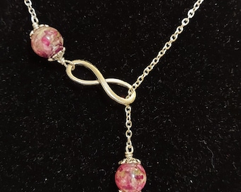 Infinity ketting met twee kralen gemaakt van je droogbloemen van begrafenissen, bruiloften of andere belangrijke gelegenheden