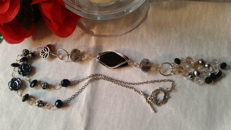 Black stone beaded wire wrapped long necklace with black and clear crystals and silver accents