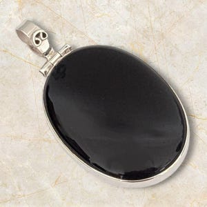 100 percent natural black onyx pendant set in GENUINE 925 sterling silver. Complimentary silver chain included