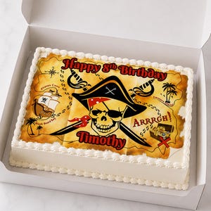 May include: A rectangular birthday cake in a white box. The cake is decorated with a pirate-themed image featuring a skull, crossed swords, and a treasure map design. Text includes "Happy 8th Birthday" and a name.
