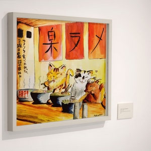 May include: A watercolor painting of three cats eating ramen in a restaurant. The restaurant has red signs with Japanese characters that read "臭ラメ" and "ファンを食べに先だ。曜日の布猫の家がは".