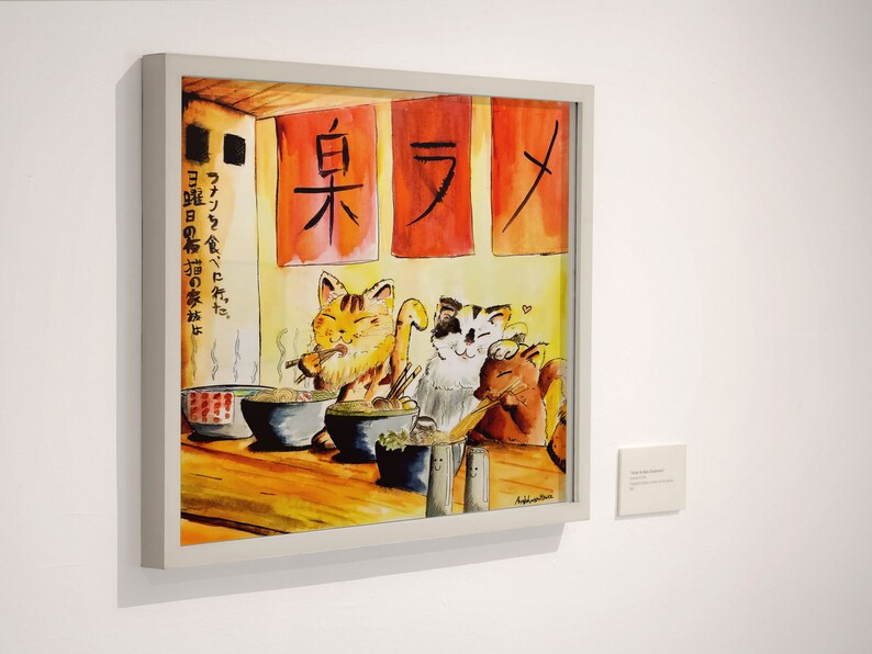 May include: A watercolor painting of three cats eating ramen in a restaurant. The restaurant has red signs with Japanese characters that read "臭ラメ" and "ファンを食べに先だ。曜日の布猫の家がは".