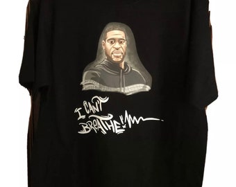 May include: Black t-shirt with a graphic of George Floyd and the words "I can't breathe" in white.