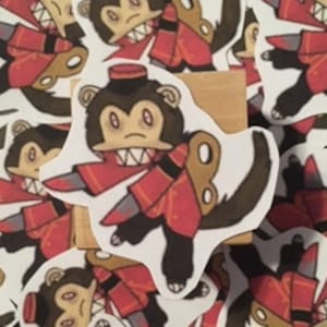 May include: A sticker of a cartoon monkey wearing a red uniform and holding a knife. The monkey has a mischievous expression and is wearing a red hat.