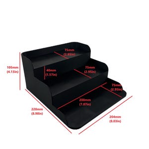 May include: Black three-tiered shelf unit with measurements in inches. The shelf is 8.98 inches wide, 7.87 inches deep, and 8.03 inches long. Each shelf is 2.95 inches deep.