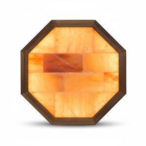 May include: An octagonal Himalayan salt lamp with a wooden frame. The lamp is filled with orange-colored salt bricks, creating a warm, inviting glow. The wooden frame is a dark brown color.