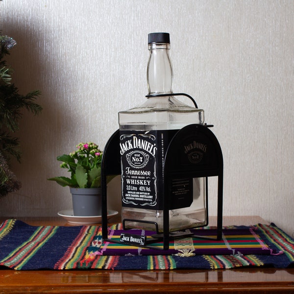 Empty 3 liter bottle of Jack Daniels on a swing