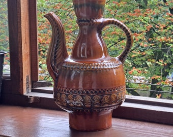 Old earthenware vessel without cover. Ukrainian ceramics. Ceramic bottle. Rustic decor majolica. Ukrainian art