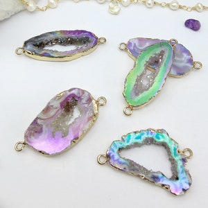 May include: Four iridescent agate gemstone connector charms with gold-toned metal loops. The agate is in shades of purple, green, and blue.