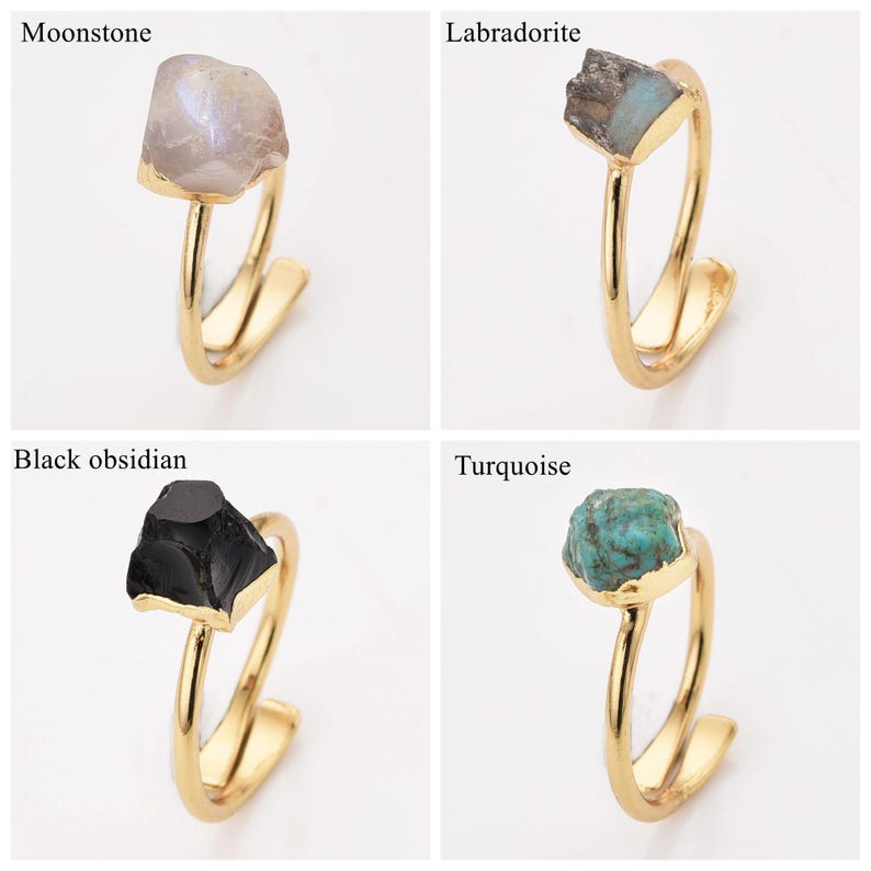 May include: Four gold-colored rings, each featuring a different gemstone: moonstone, labradorite, black obsidian, and turquoise. The gemstones are rough-cut and set in a simple, elegant design.