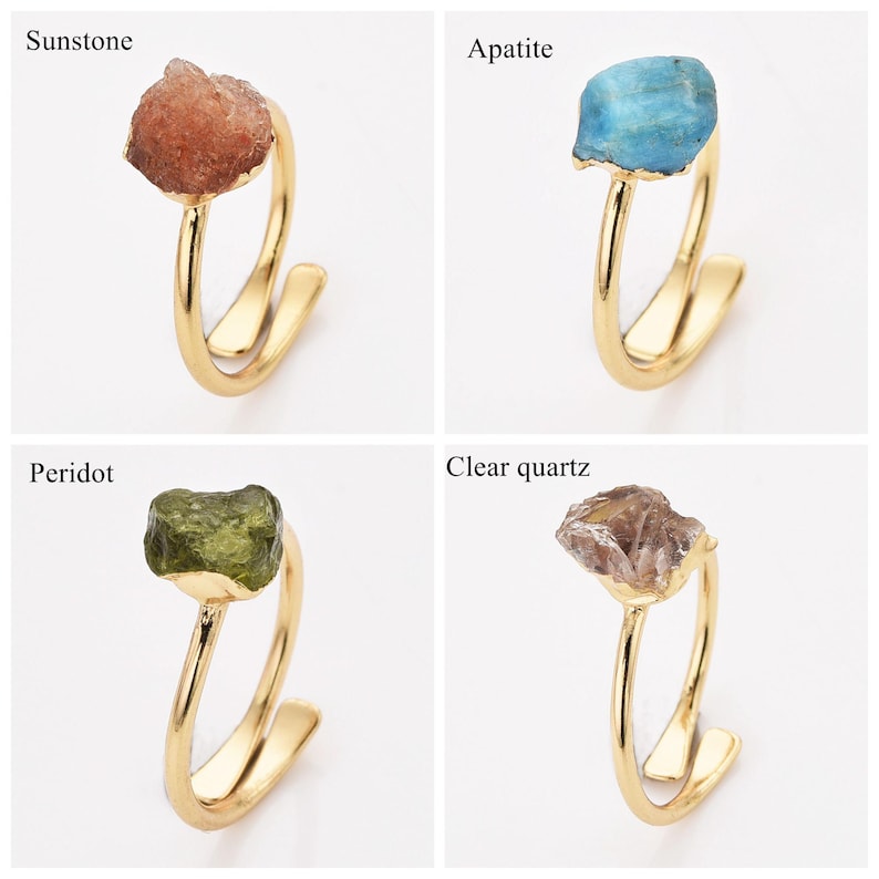 May include: Four gold-colored rings, each featuring a different gemstone: sunstone, apatite, peridot, and clear quartz. The gemstones are rough-cut and set on a minimalist, open-style band.