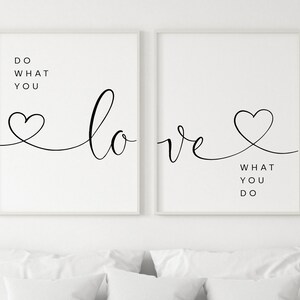 May include: Two framed art prints with white backgrounds. The left print reads "DO WHAT YOU LOVE" in black script and block letters, with a heart-shaped design. The right print reads "LOVE WHAT YOU DO" with a heart design.