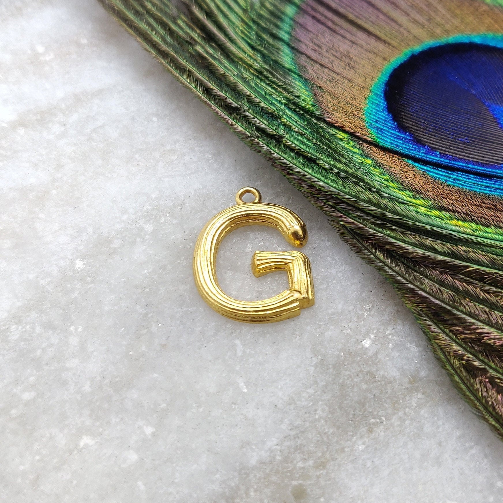 Gold g charm deals