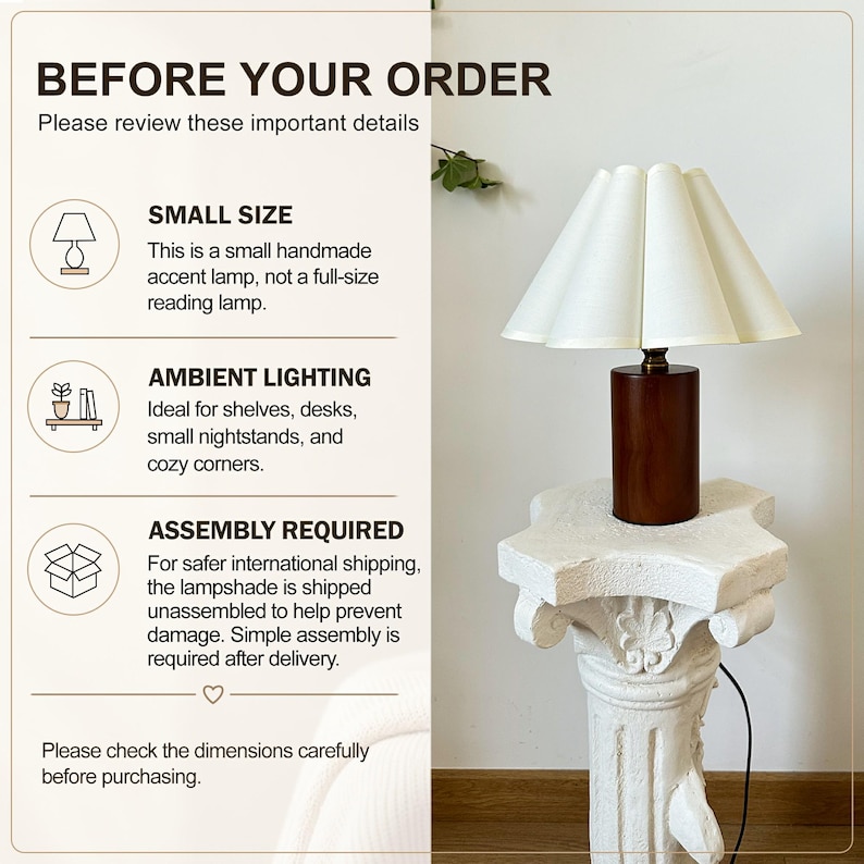 May include: A small accent lamp with a cylindrical dark wood base and a pleated white lampshade. The image includes text: BEFORE YOUR ORDER, SMALL SIZE, AMBIENT LIGHTING, ASSEMBLY REQUIRED, and instructions to review details and check dimensions.