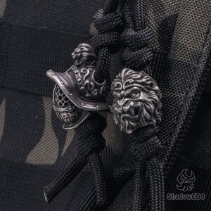 Side angle showing lion crest on helmet top referencing Roman military iconography.