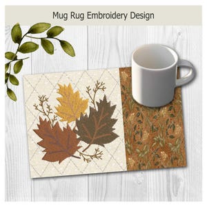 May include: A rectangular mug rug featuring an embroidered design of three autumn leaves in yellow, brown, and dark brown on a cream diamond-patterned background, next to a section with a dense orange and green botanical print and a white mug.