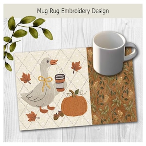 May include: A rectangular mug rug featuring an embroidered design of a gray goose wearing a yellow ribbon, holding a coffee cup, and standing next to an orange pumpkin and fallen leaves on a cream diamond-patterned background with a brown border.