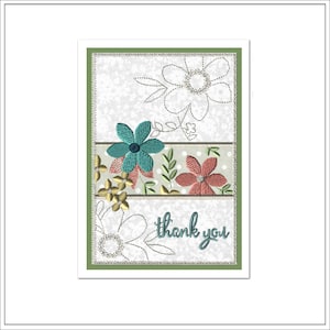 May include: A green card with a white background and a floral design. The flowers are embroidered in shades of teal, pink, and yellow. The text "thank you" is written in cursive at the bottom of the card.