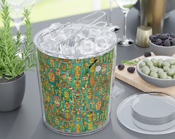 May include: A clear plastic ice bucket with a tiki-themed design. The bucket is filled with ice and has a matching lid and tongs.