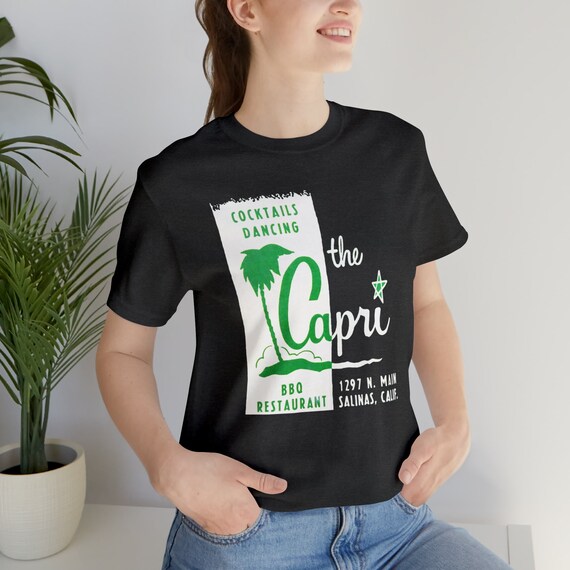 Retro Capri Cocktail Lounge on a Unisex Bella+Canvas Short Sleeve Tee. Mid Century Modern BBQ and Dancing Get that dive bar vibe going