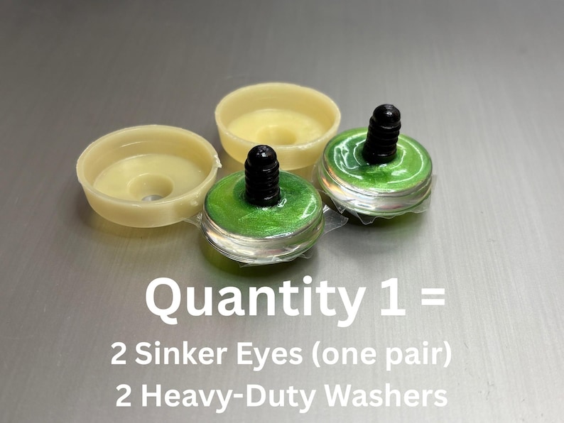 May include: Two green sinker eyes with black stems and two cream-colored heavy-duty washers. The text reads: Quantity 1 = 2 Sinker Eyes (one pair) 2 Heavy-Duty Washers. These components are designed for craft projects requiring secure attachment.