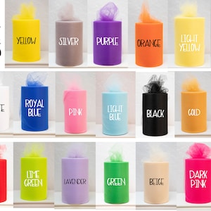 May include: A collection of 6 inch by 100 yard tulle rolls in various colors, including yellow, white, silver, purple, orange, light yellow, hot pink, hunter green, royal blue, pink, light blue, black, gold, aqua, light pink, red, lime green, lavender, green, beige, dark pink, brown, and ivory.
