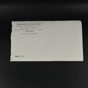 May include: A white envelope with text from the Treasury Department, United States Assay Office, 350 Duboce Street, San Francisco, Calif. 94102. The text "OFFICIAL BUSINESS" is printed below the address. The year "1968 - U. C." is printed at the bottom.