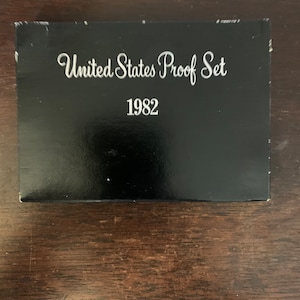 May include: A black box with white text that reads "United States Proof Set 1982".