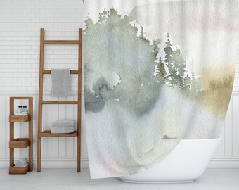 May include: A watercolor shower curtain with a misty forest scene in shades of green, gray, and brown. The curtain is hanging in a bathroom with a white tiled wall and a white bathtub.