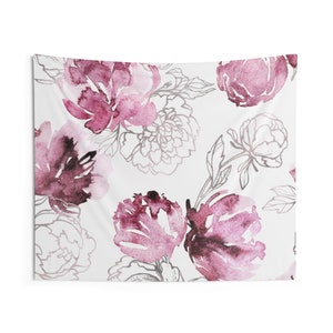 May include: A white tapestry featuring a watercolor floral design. The design includes large, blooming peonies in shades of deep pink and burgundy, with delicate gray outlines of additional flowers and leaves. The overall aesthetic is soft and romantic.