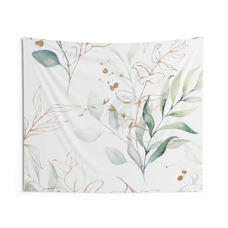 May include: A white tapestry with a watercolor pattern of green and gold leaves. The leaves are arranged in a random pattern and have a delicate, flowing look.