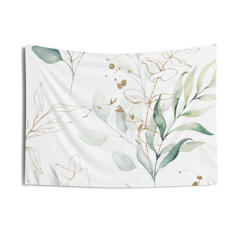 May include: A white tapestry with a watercolor pattern of green leaves and gold accents.