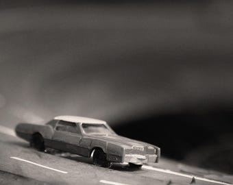 On The Road Again - Close Up Miniature Toy Car Art on Giant Tire