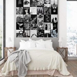 May include: A black and white collage of images featuring fashion, cityscapes, and iconic logos, such as Chanel and Playboy, displayed on a wall above a white bed with a grey blanket.