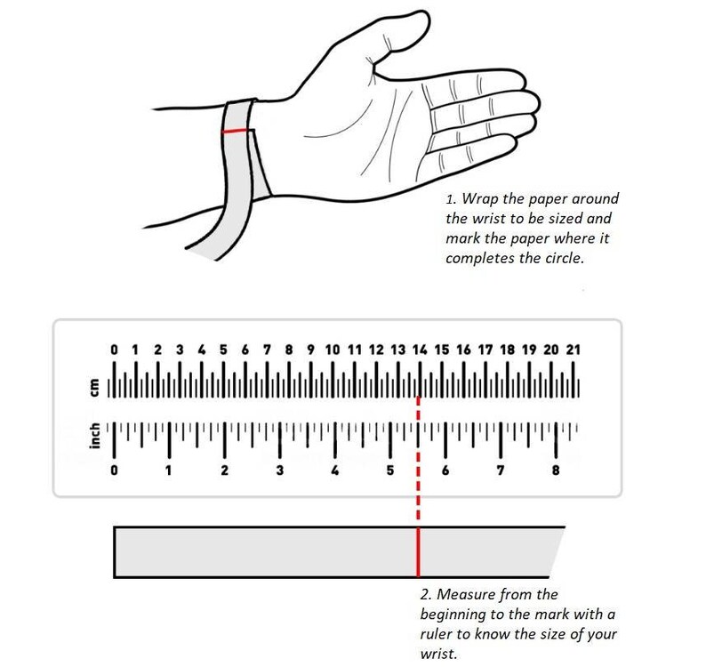 May include: A diagram showing how to measure your wrist for a bracelet. Wrap a piece of paper around your wrist and mark where it overlaps. Then, measure the length of the paper with a ruler. The ruler shows measurements in inches and centimetres.
