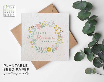May include: Plantable seed paper greeting card with a floral wreath design and the text "You're bloomin' amazing!"