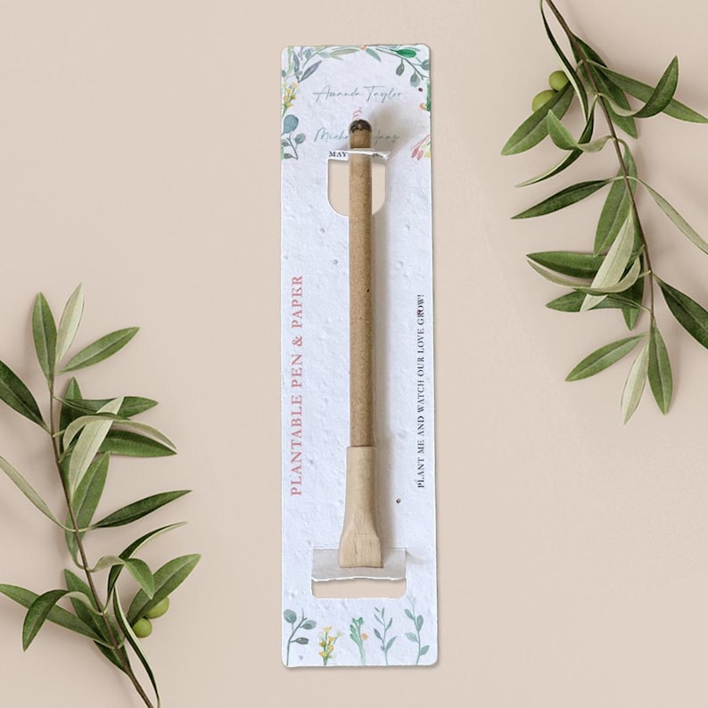 May include: A brown plantable pen and paper card with white floral designs. The card has the text "PLANT ME AND WATCH OUR LOVE GROW!" and "PLANTABLE PEN & PAPER".