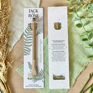 May include: A plantable pen and paper set. The pen is light brown with a seed capsule. The packaging is white with fern illustrations and the text "Plantable Pen & Paper". The text "Plant Me and Watch Our Love Grow!" is also visible.